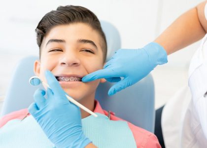 braces implantation lp bg A young boy getting braces implantation