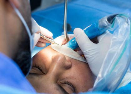 dentist and assistant with tool makes some manipulations in the patient’s mouth dentist and assistant with tool makes some manipulations in the patient's mouth